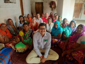 group of people sitting on the floor smiling